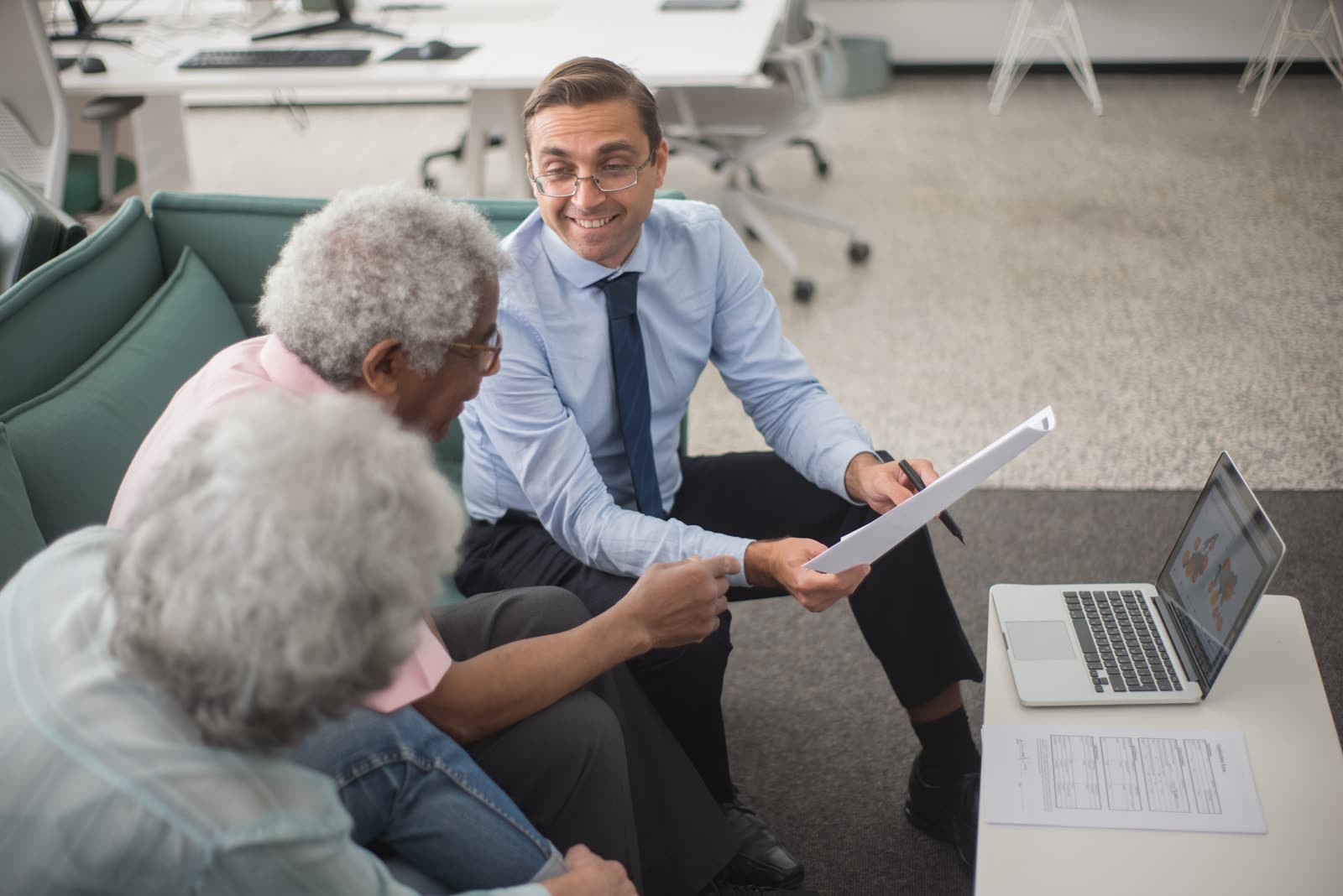 A McGee's Consulting advisor reviewing tax and financial plans with a corporate client